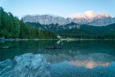 Scenic view of lake and mountains against sky