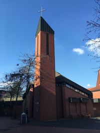 Low angle view of building against blue sky