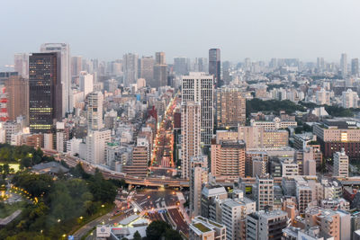 High angle view of modern buildings in city against sky