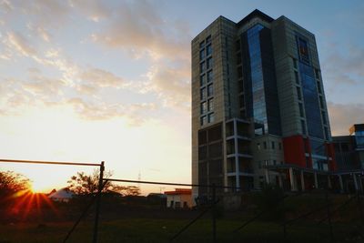 Low angle view of office building against sky