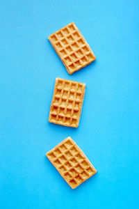 High angle view of coffee on blue background