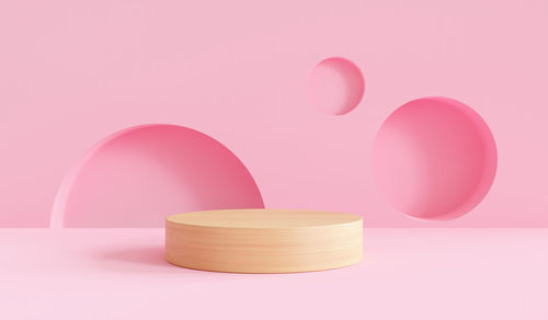 Close-up of pink candle against white background