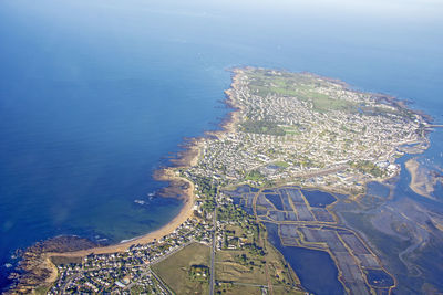 Aerial view of sea and cityscape