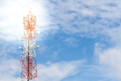 Low angle view of communications tower against sky