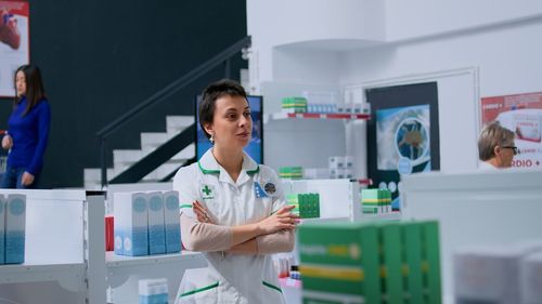 Portrait of female doctor standing in laboratory