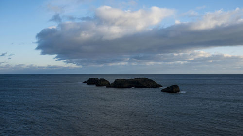 Scenic view of sea and cloudy sky