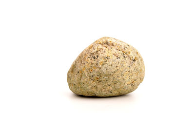 Close-up of pebbles against white background