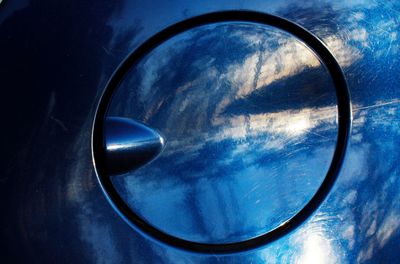 Low angle view of blue sky seen through glass