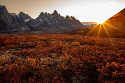 Scenic view of mountains against sky during sunset