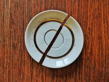 Close-up of broken saucer on table