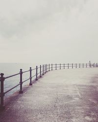 Pier on sea against sky