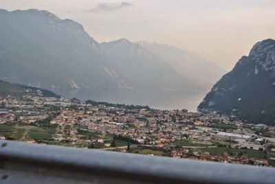 High angle view of townscape and mountains against sky