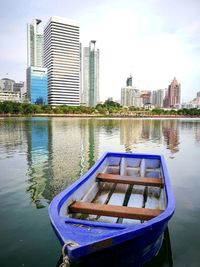 Boat in city at waterfront