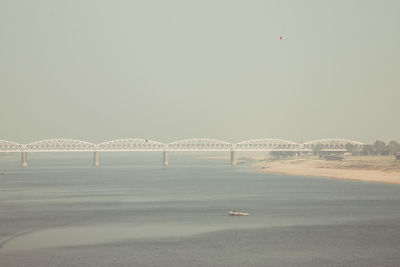 View of bridge over sea against clear sky