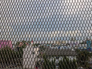 Full frame shot of chainlink fence against sky