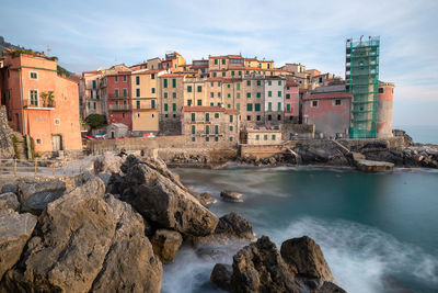 Panoramic view of sea and buildings against sky