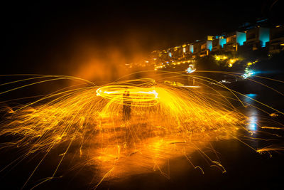 Aerial view of illuminated city at night