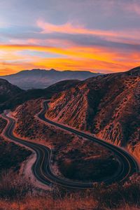 High angle view of mountain road against sky during sunset