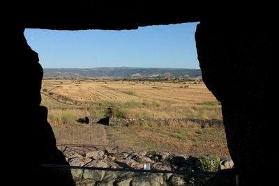 Scenic view of silhouette field against clear sky