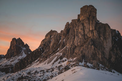 Scenic view of snowcapped mountains against sky during sunset