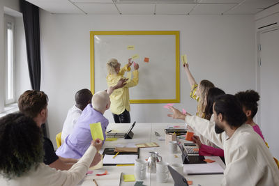 Diverse team brainstorming during business meeting in conference room