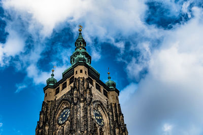 Low angle view of bell tower against sky