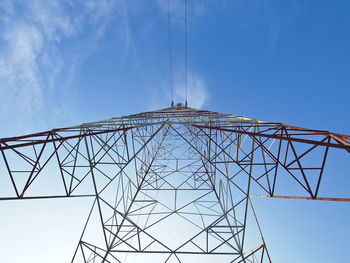 Beautiful high voltage tower in sunlight and blue sky