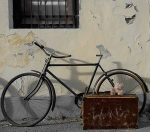 Close-up of bicycle against window