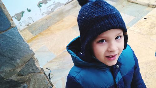 Portrait of smiling boy in warm clothes