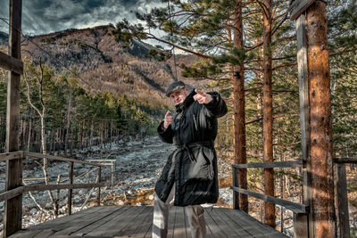 Full length of a man standing in the forest