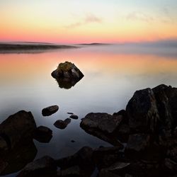 Scenic view of sea at sunset