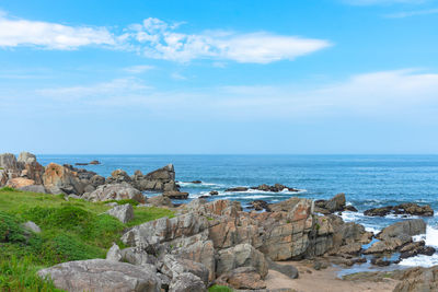 Tanesashi kaigan coast. the coastline includes sandy and rocky beach, grassy meadows scenic sea view