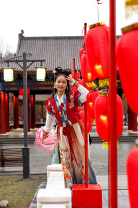 Rear view of woman standing in city