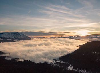 Scenic view of silhouette mountains against sky during sunset