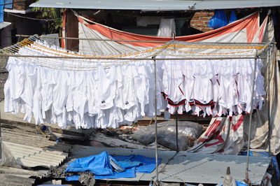 Clothes drying on rope against building