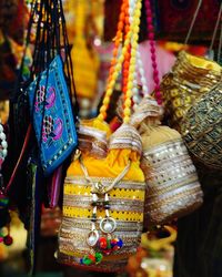 Close-up of clothes hanging for sale at market stall