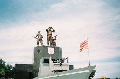 Low angle view of statue against sky