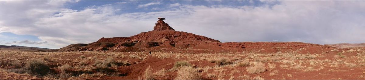 View of rock formations on landscape against sky