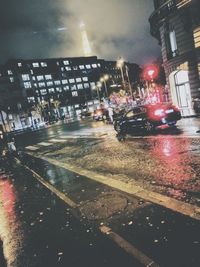 Cars on road in city at night