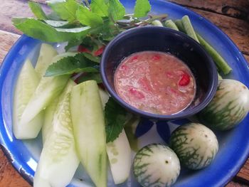 High angle view of chopped fruits in bowl on table