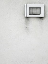 Close-up of light switch on wall