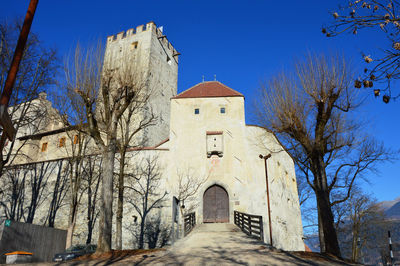 Low angle view of church against blue sky