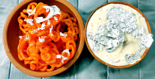 High angle view of chopped fruits in bowl on table