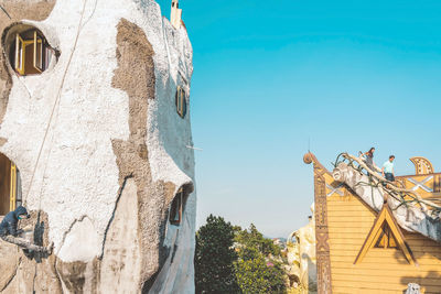 Low angle view of traditional building against clear blue sky