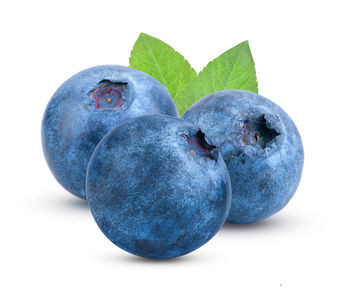 Close-up of fruit against white background