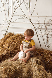 Children at easter with rabbits and ducks