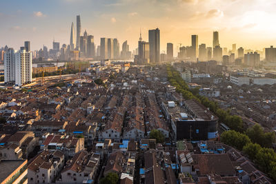 High angle view of modern buildings in city against sky