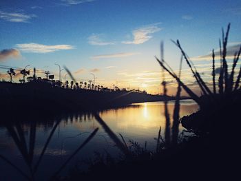 Scenic view of calm lake at sunset