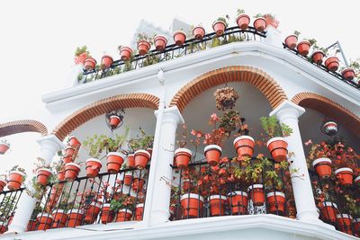 Low angle view of lantern on building against sky