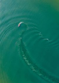 Aerial view of boat in turquoise sea